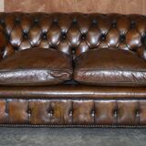 Restored leather Chesterfield sofa, walnut legs.