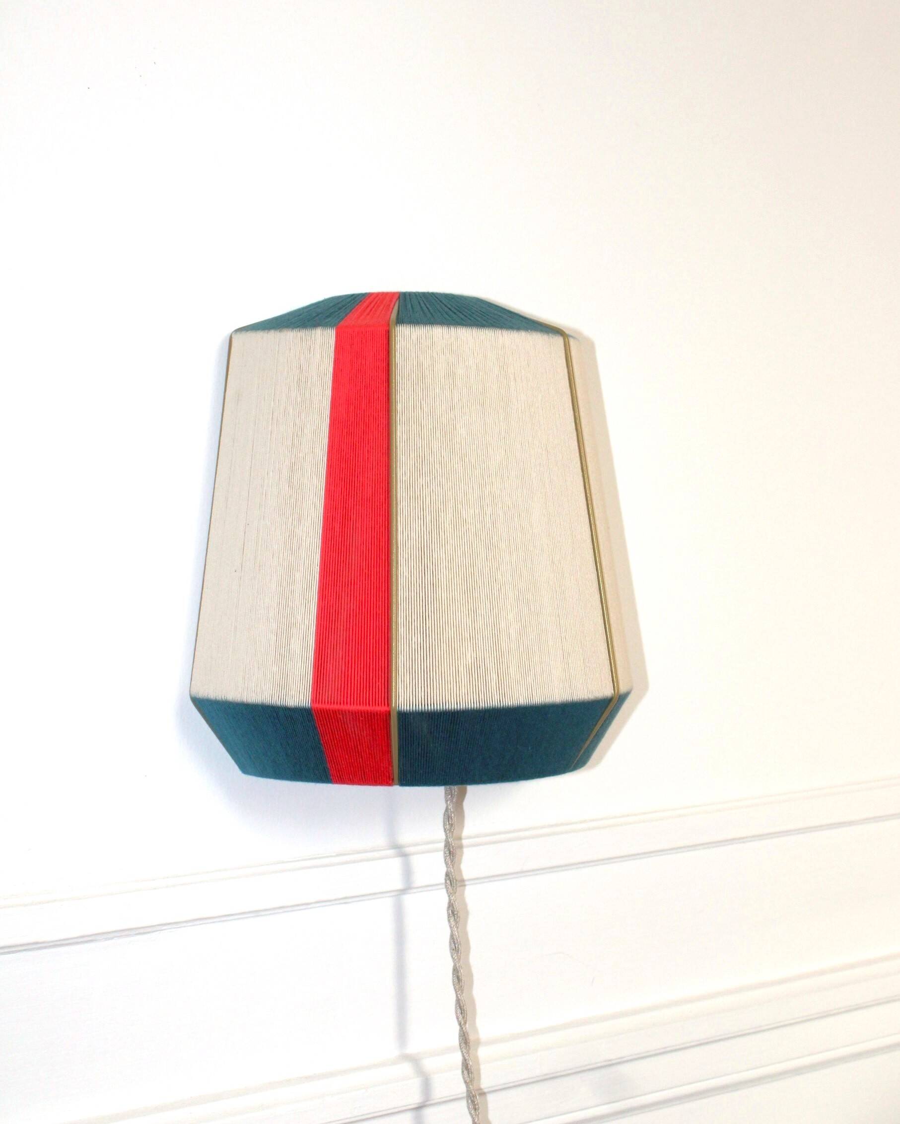 The Epicurienne coral peacock wall light