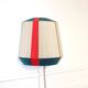 The Epicurienne coral peacock wall light