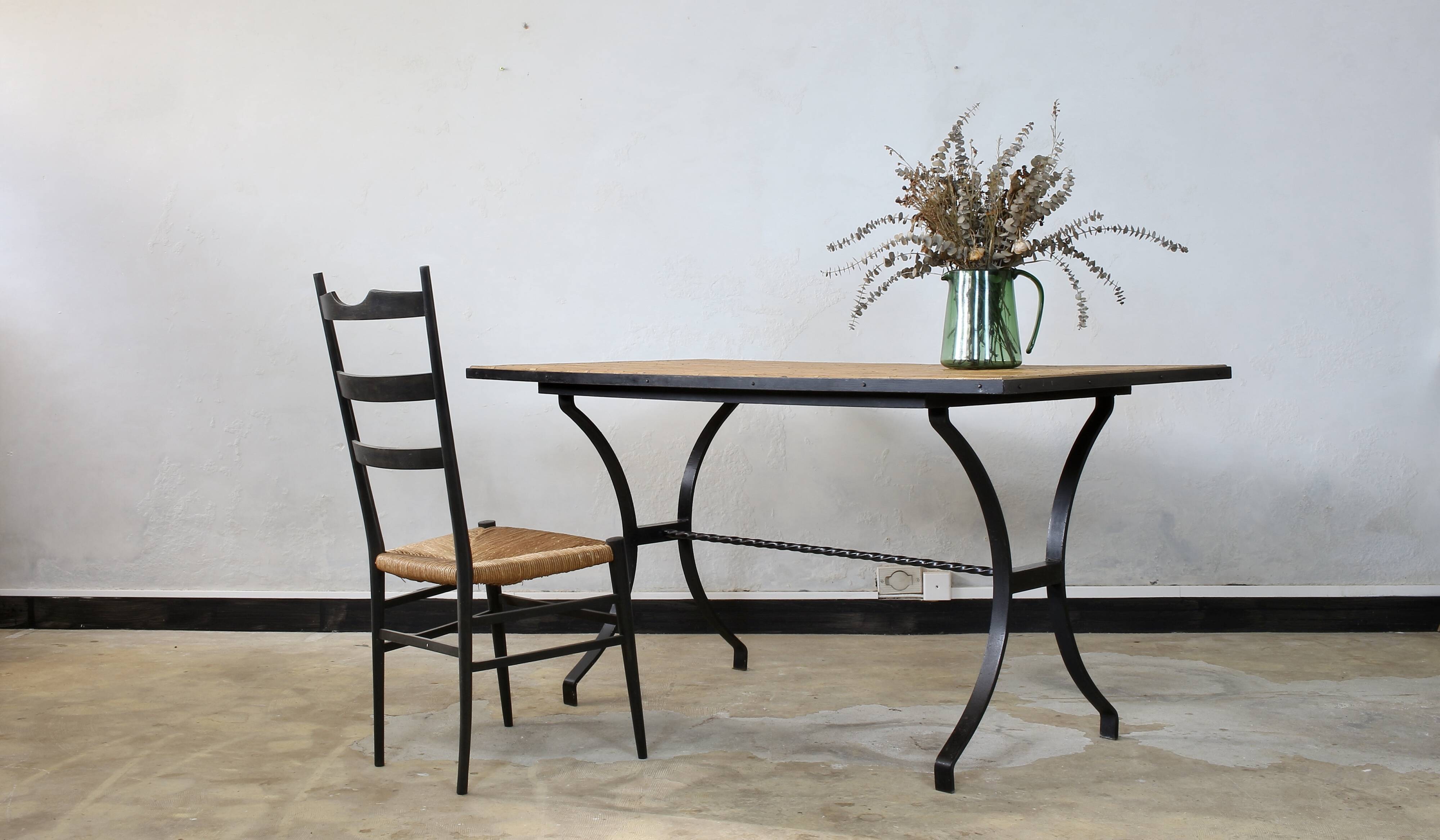 Dining table in rattan and wrought iron similar to Audoux & Minet.