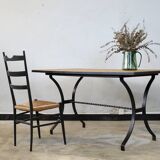 Dining table in rattan and wrought iron similar to Audoux & Minet.