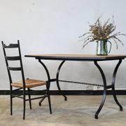 Dining table in rattan and wrought iron similar to Audoux & Minet.