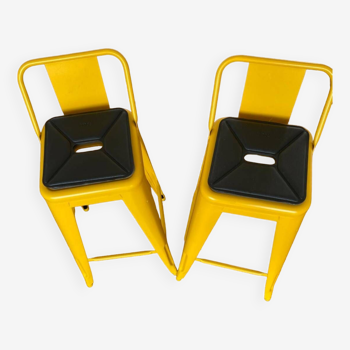 Pair of yellow Tolix high chairs