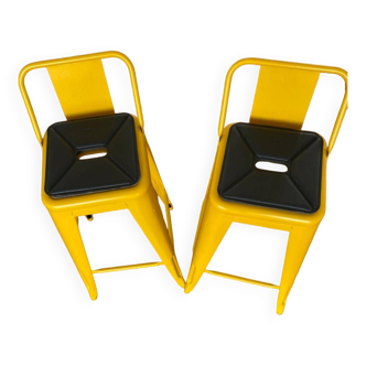 Pair of yellow Tolix high chairs
