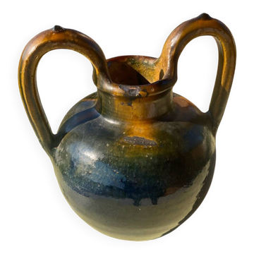 Glazed earthenware pottery in the shape of a jug or jar