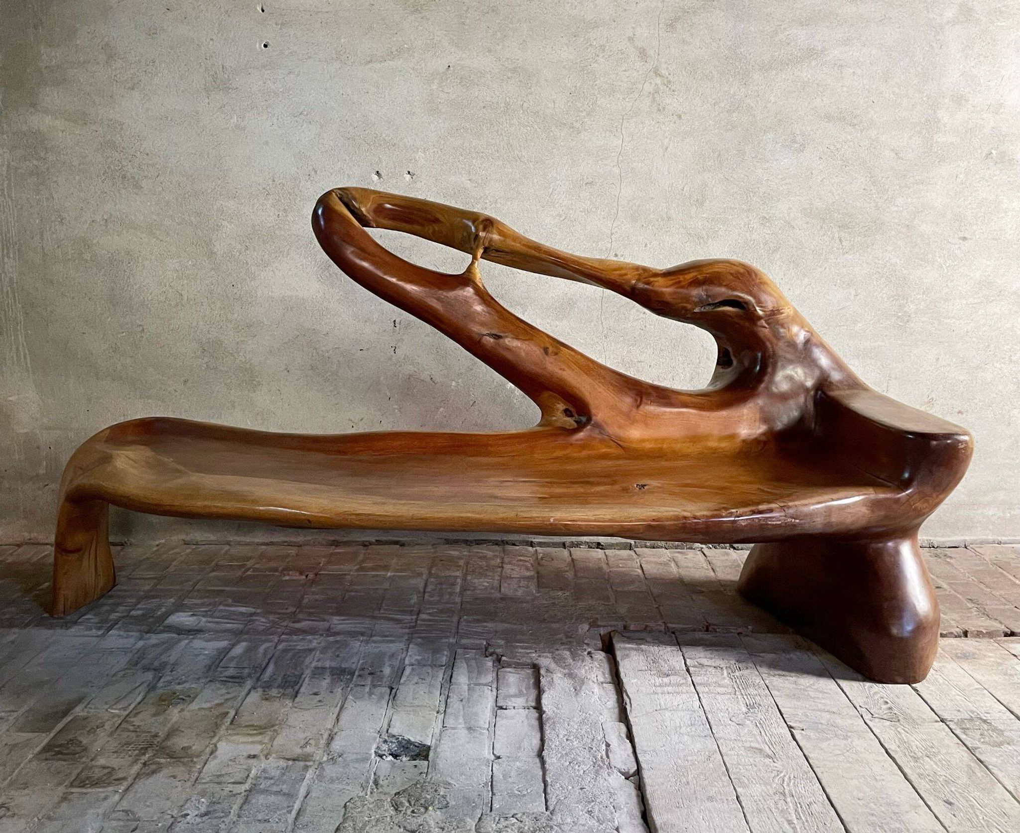 Sculptural bench in solid wood