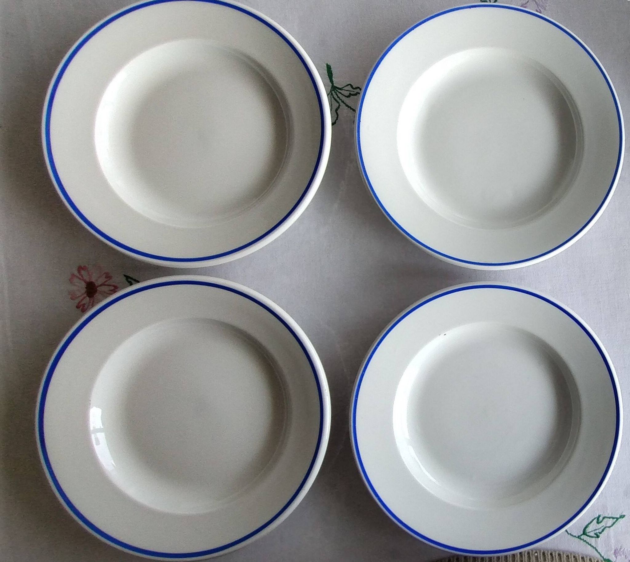 3 Pillivuyt white porcelain dinner plates with blue edging.