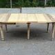 Round extendable dining table with flaps, stripped in raw oak, with 4 extensions.