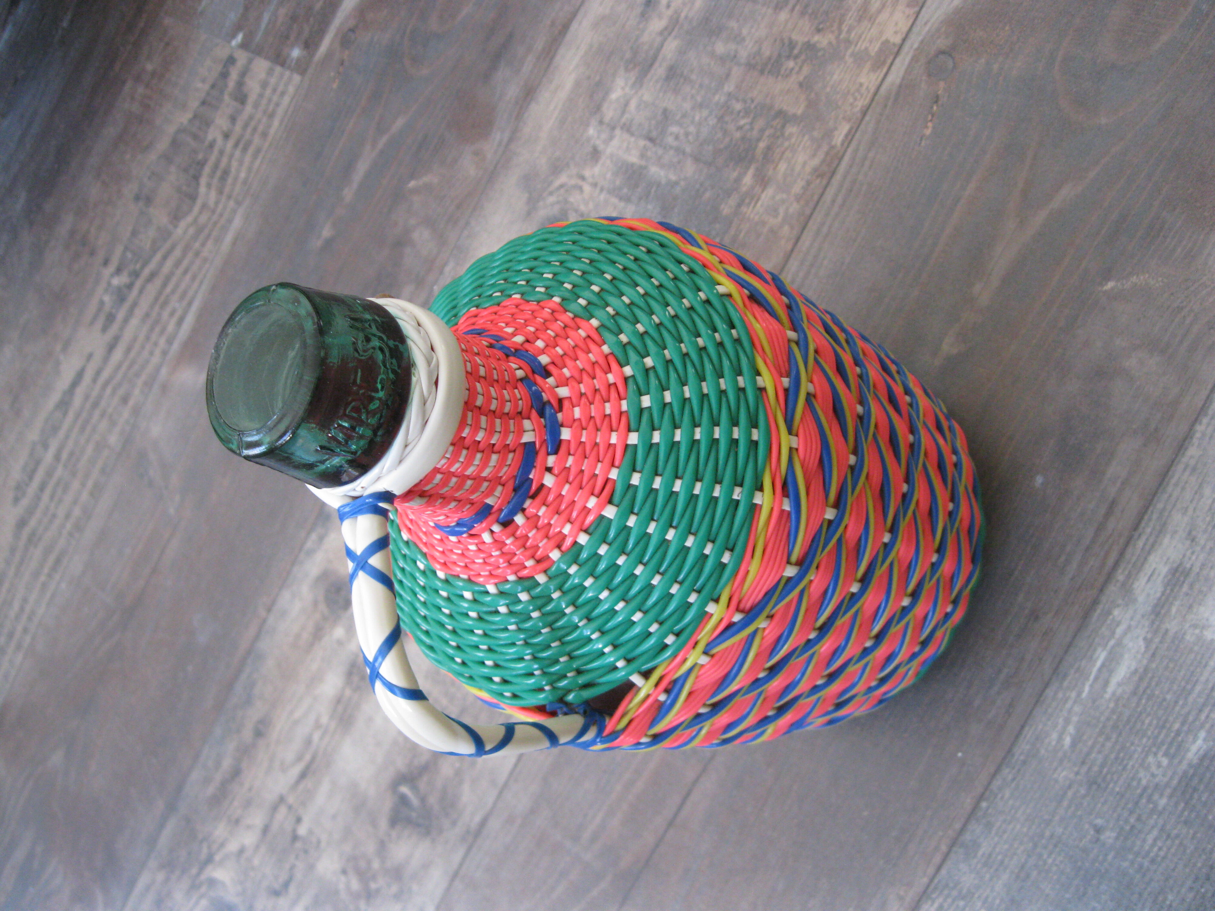 Vintage and multi-coloured demijohn