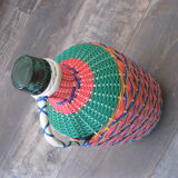 Vintage and multi-coloured demijohn