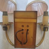 Vintage wall sconces in brass with pleated fabric shades.