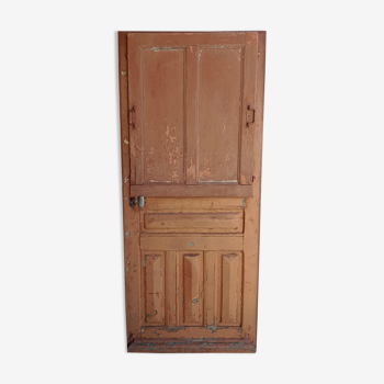 Old glazed door with its shutter