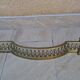 Louis XVI style bronze andirons and fireplace bar