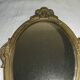 Ancien miroir face à main en bronze doré