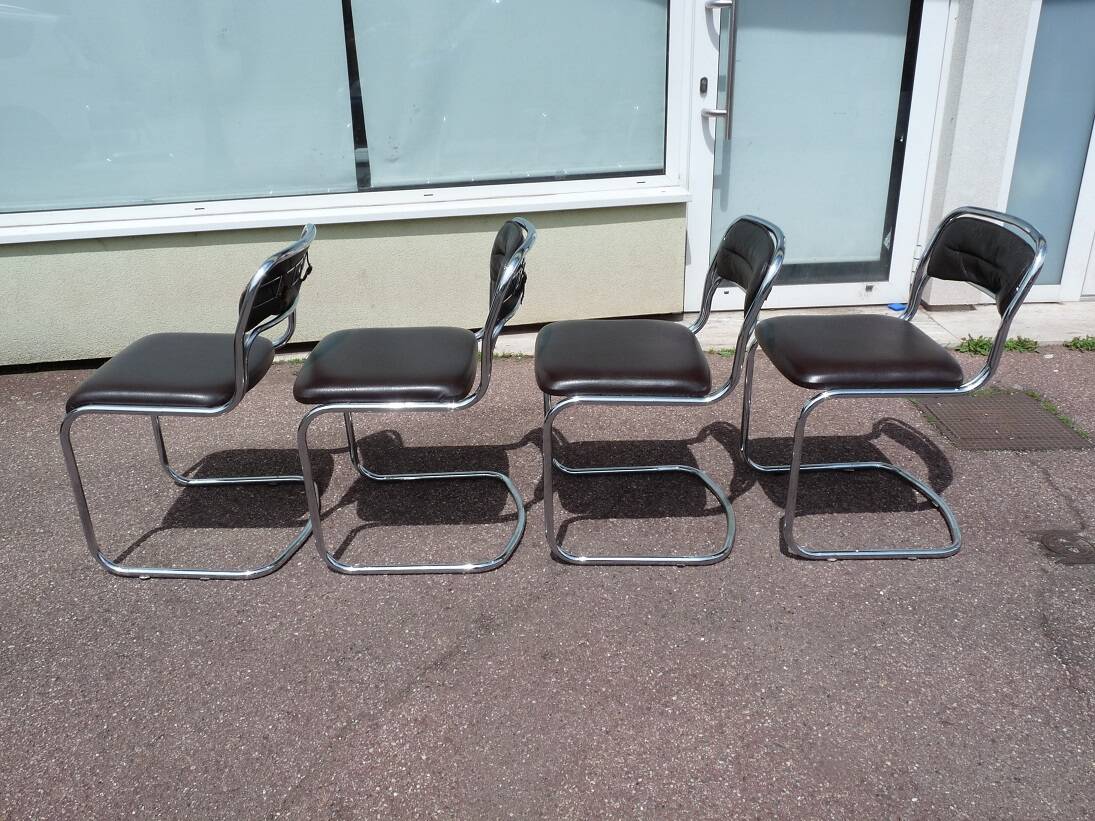 Set of 4 chrome metal and vintage leather chairs