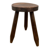 Small brutalist tripod stool in solid wood.