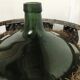 Dame jeanne de 100 litres avec son panier en métal