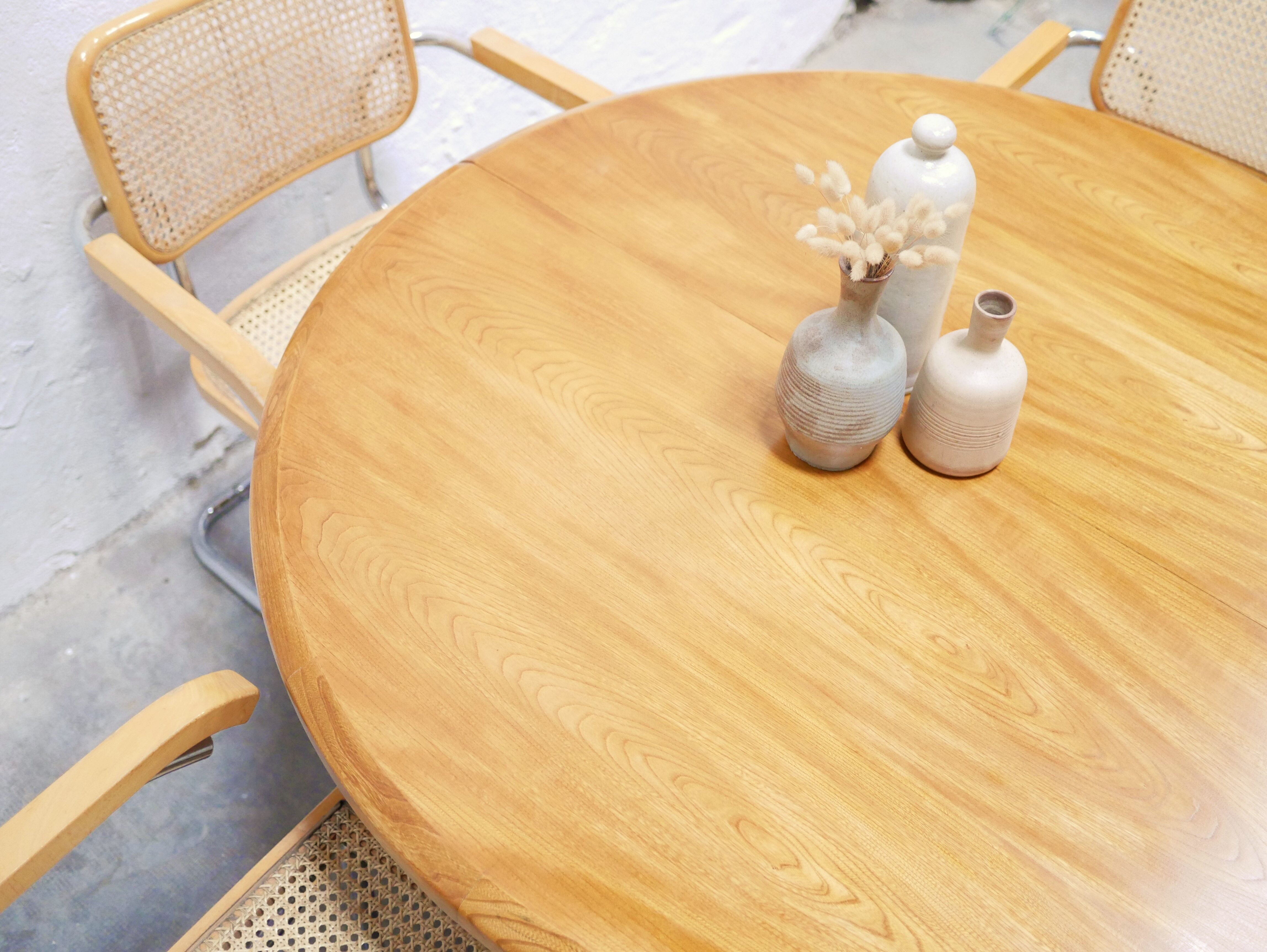 Vintage extendable round wooden dining table