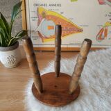 Old farm stool, wooden tripod campaign