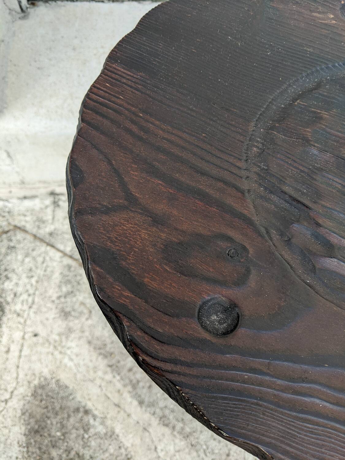 Tripod stool, horseshoe, rustic brutalist decoration.