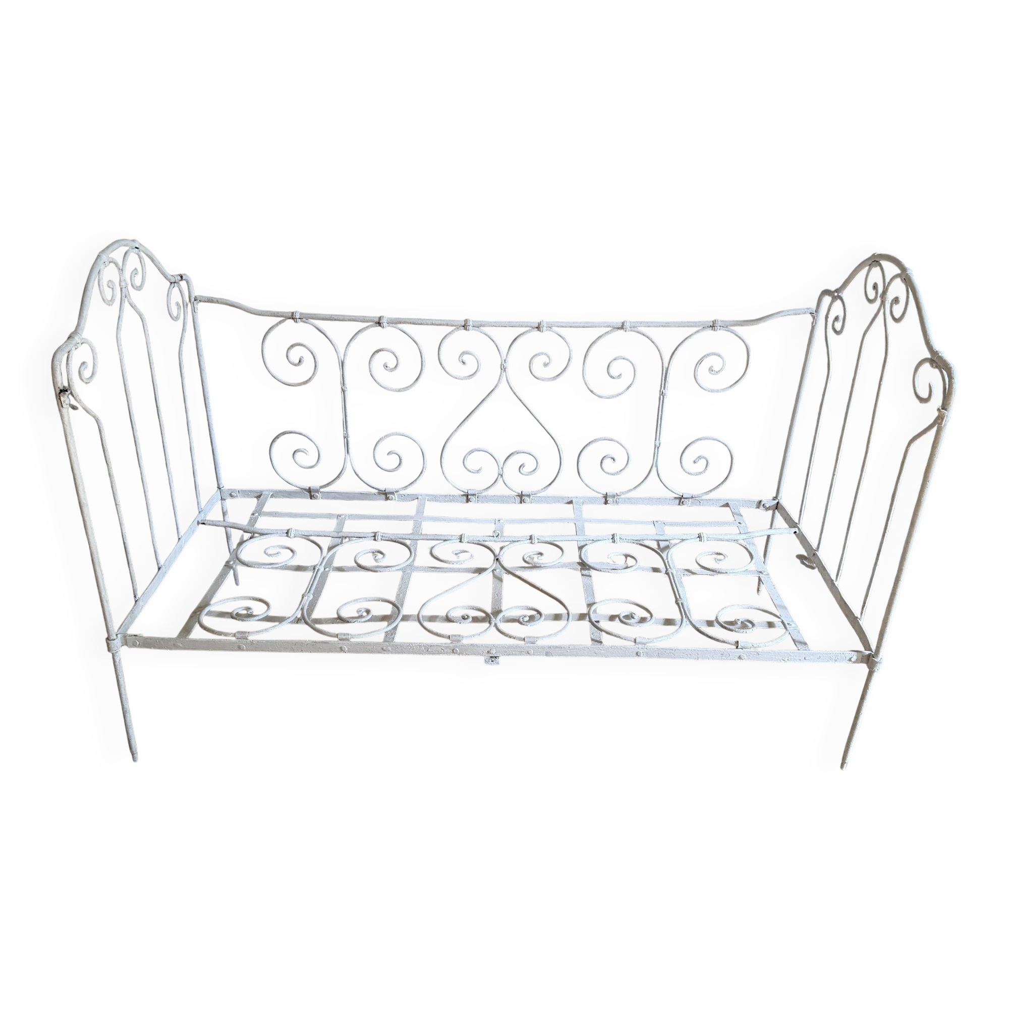 Small renovated wrought iron bed