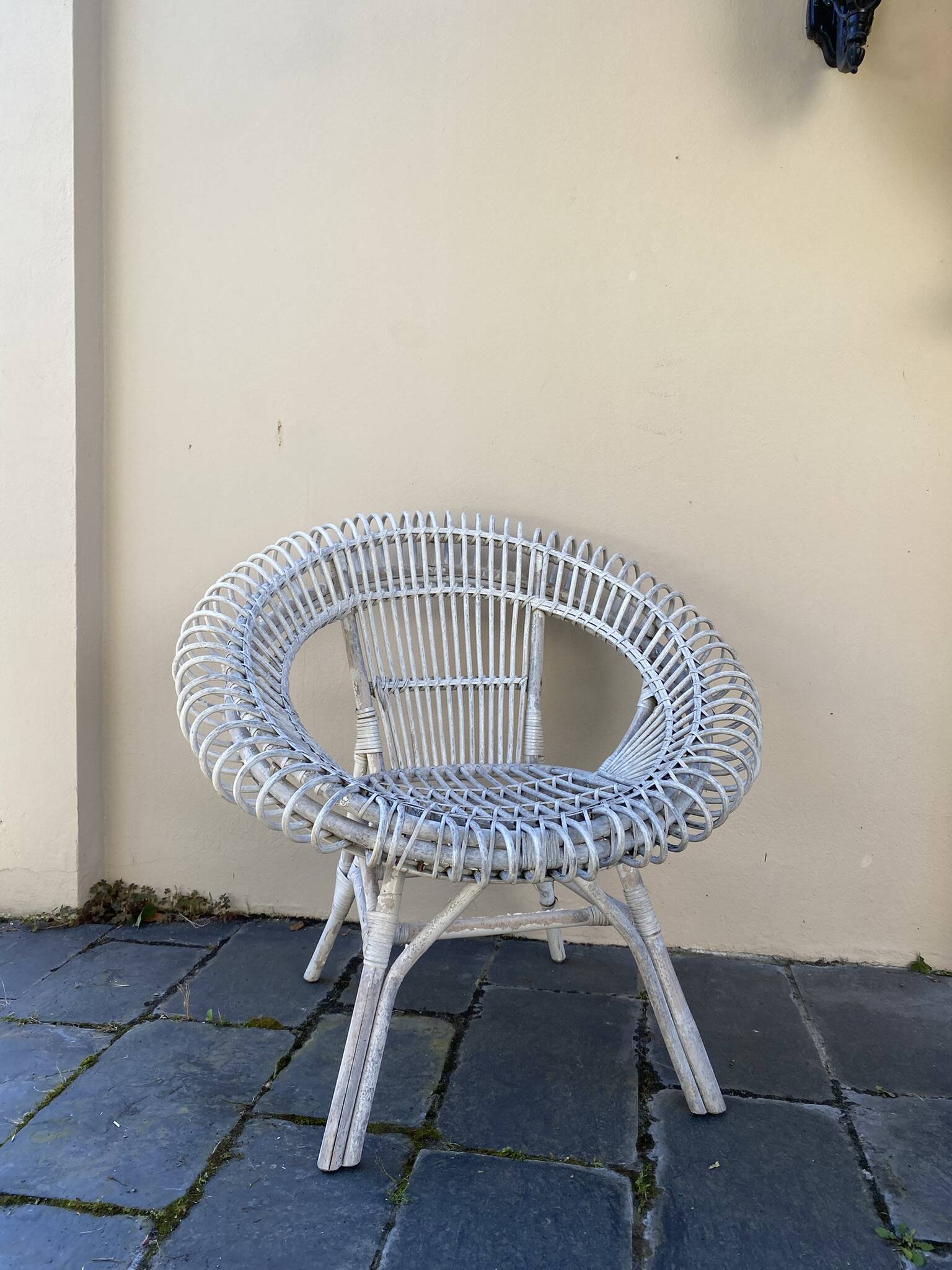Vintage white rattan armchair