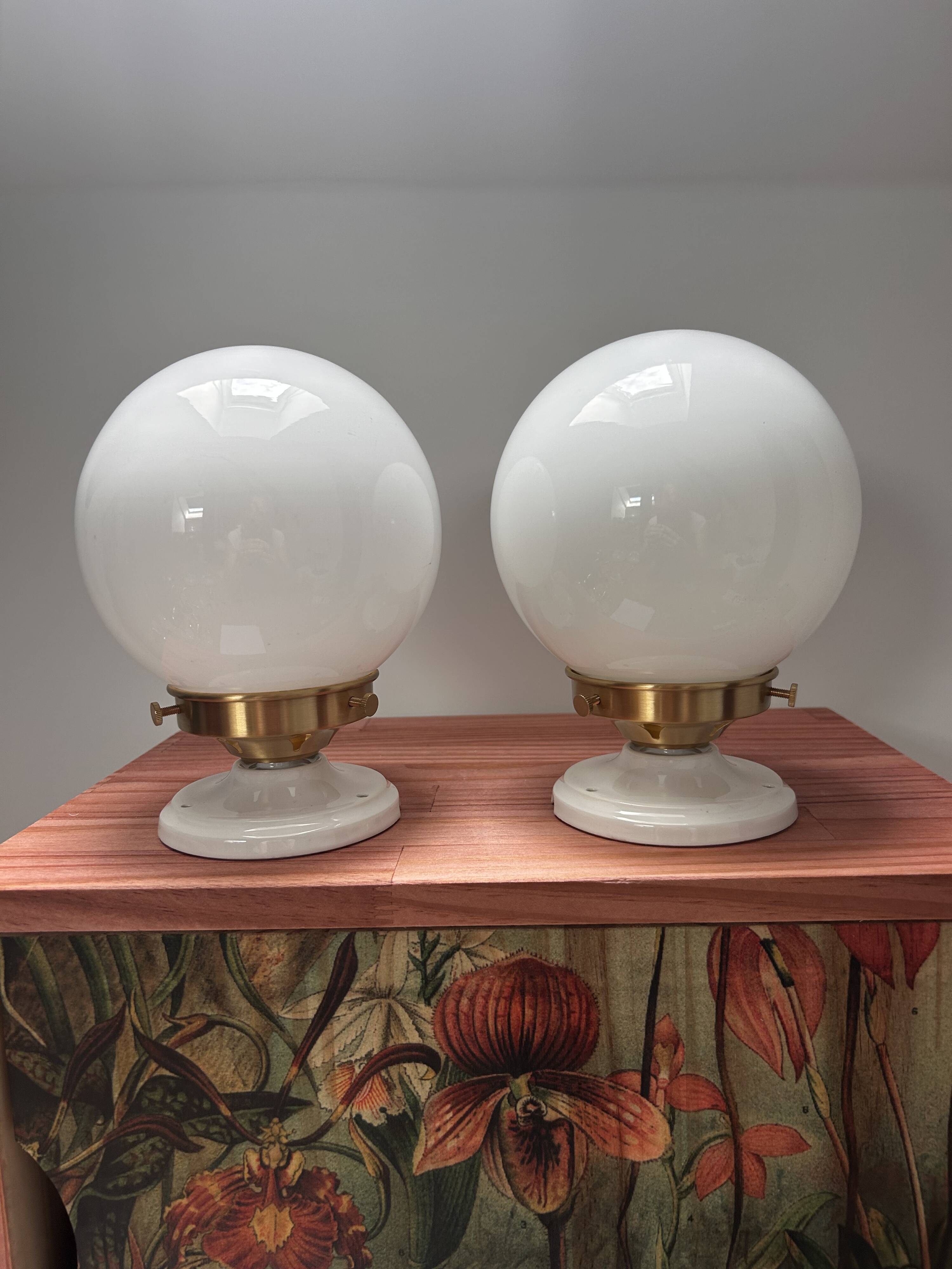 Set of two white opaline ball wall lights