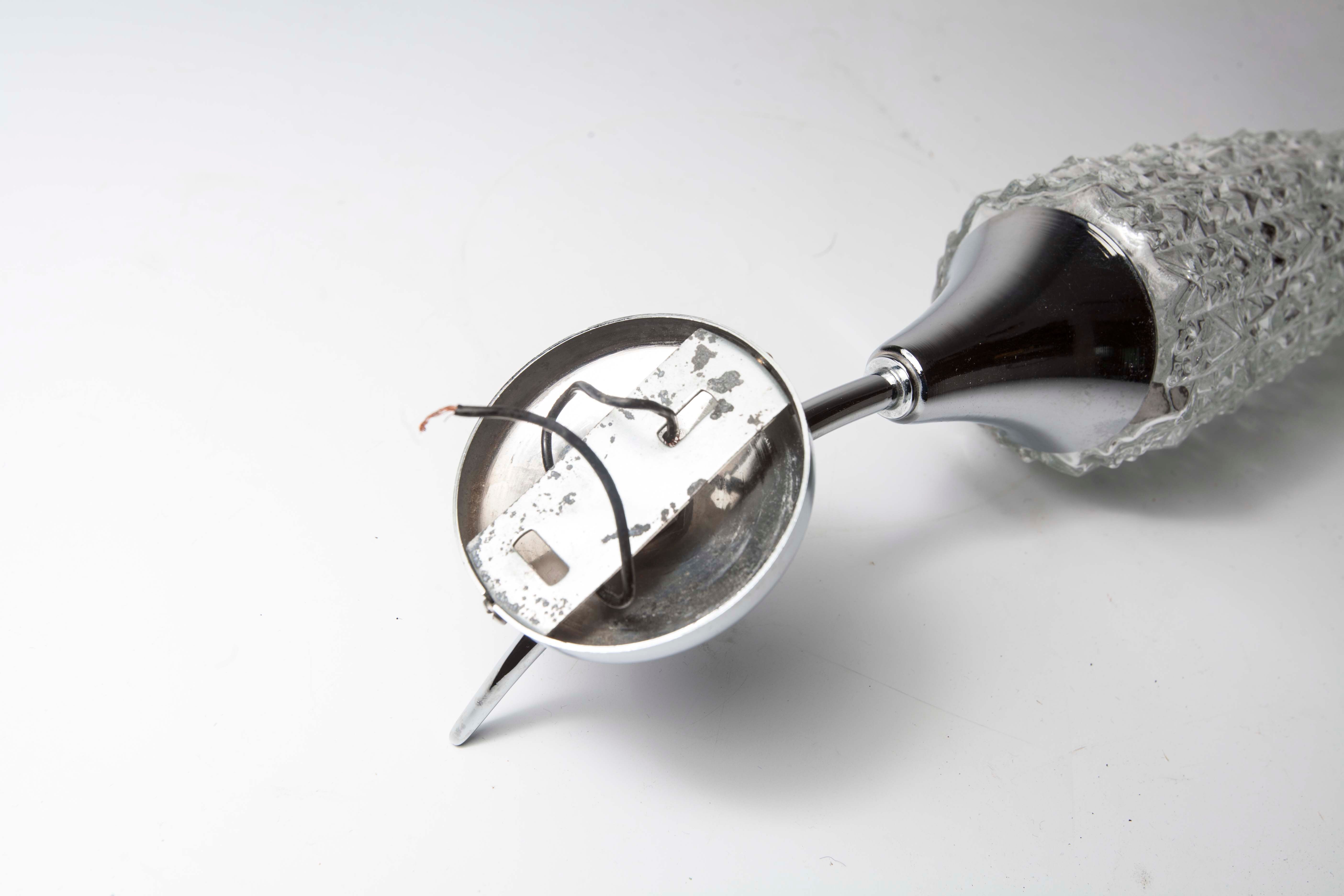 Torch wall lampof the 60s in silver and glass