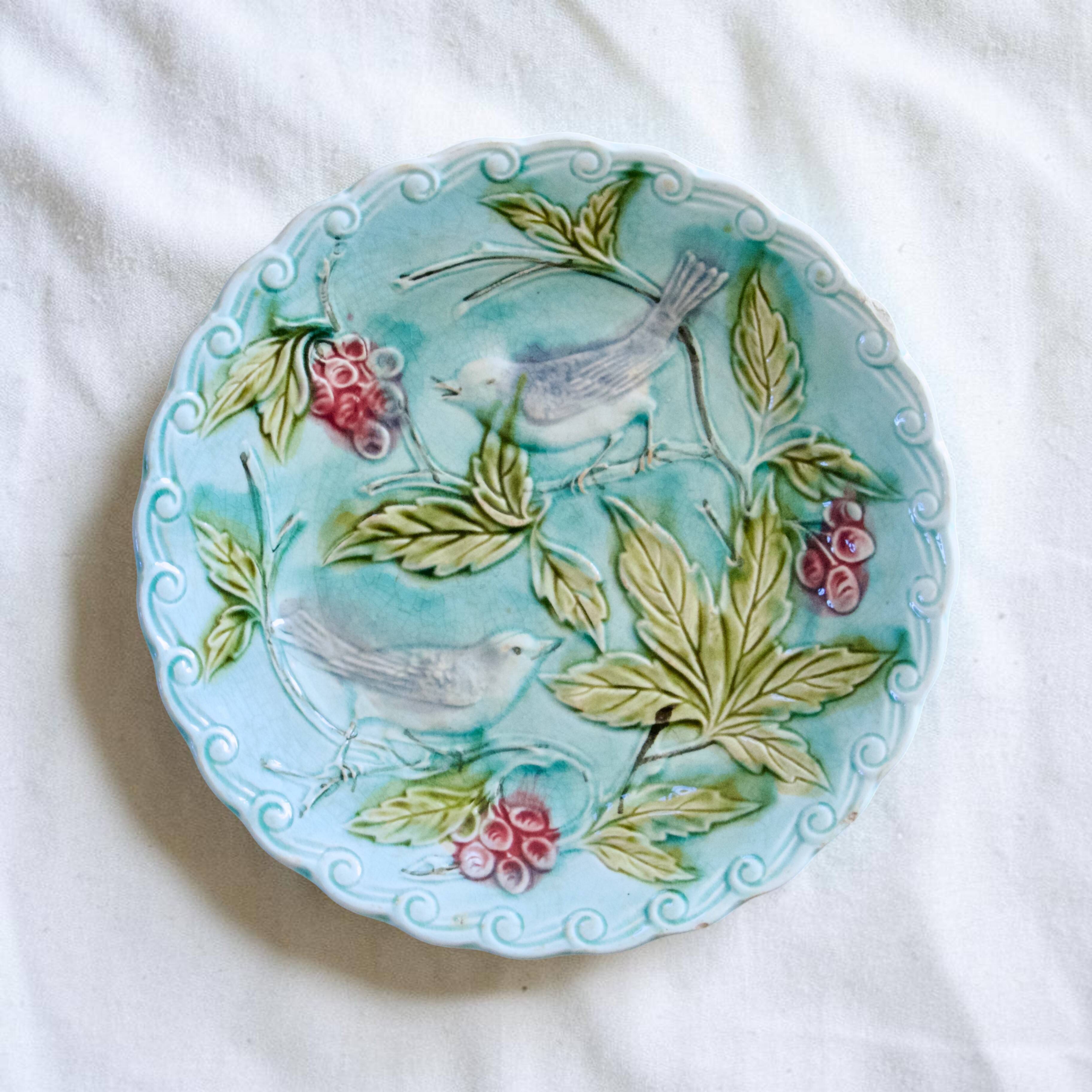 19th-century trio of plates in turquoise bird majolica.