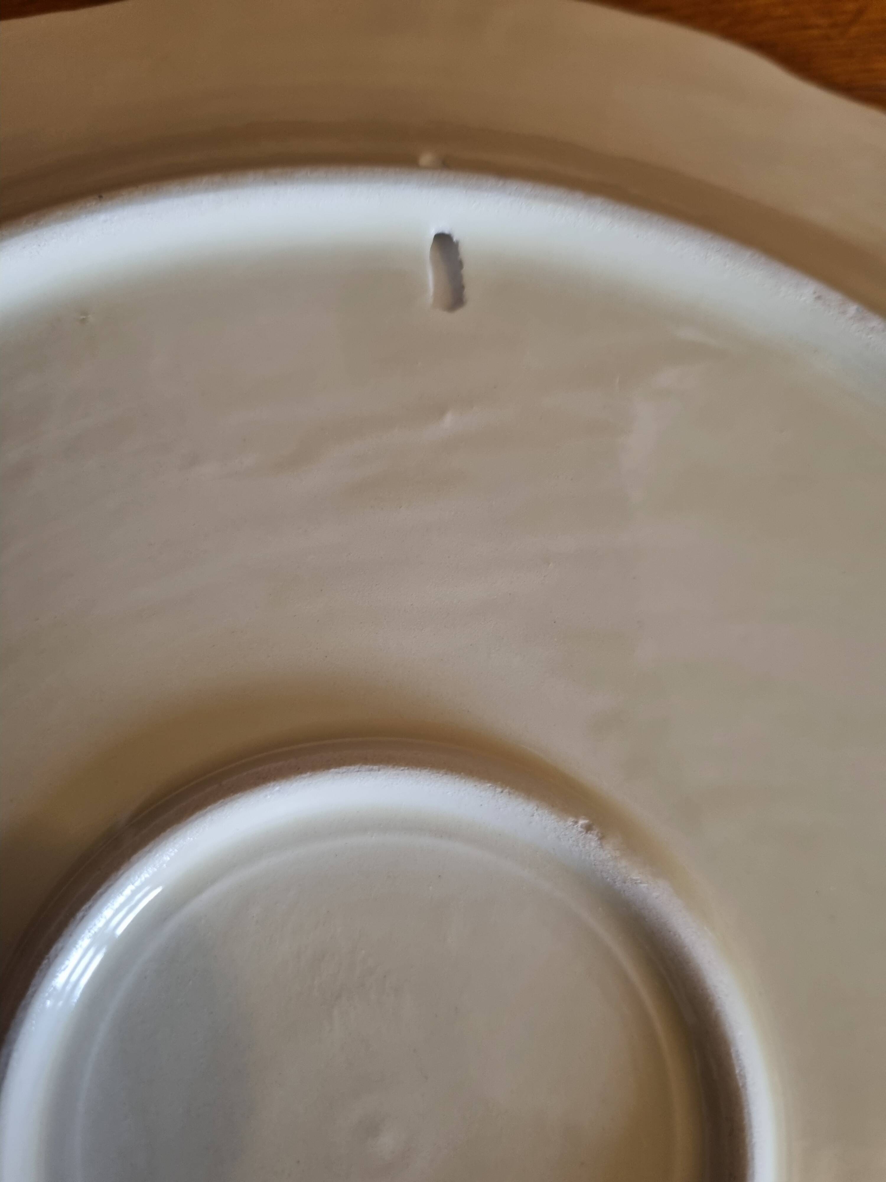 Large vintage earthenware dish with a fruit pattern.