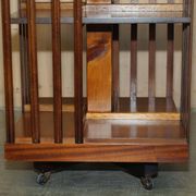 Sheraton Revival rotating library table in walnut and satin wood.