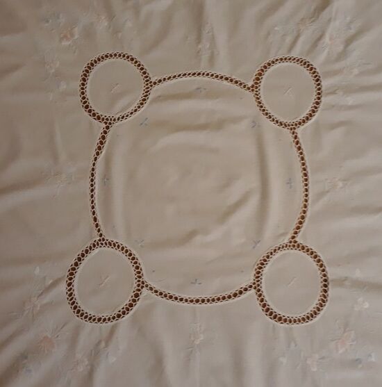 White tablecloth embroidered with lace & days