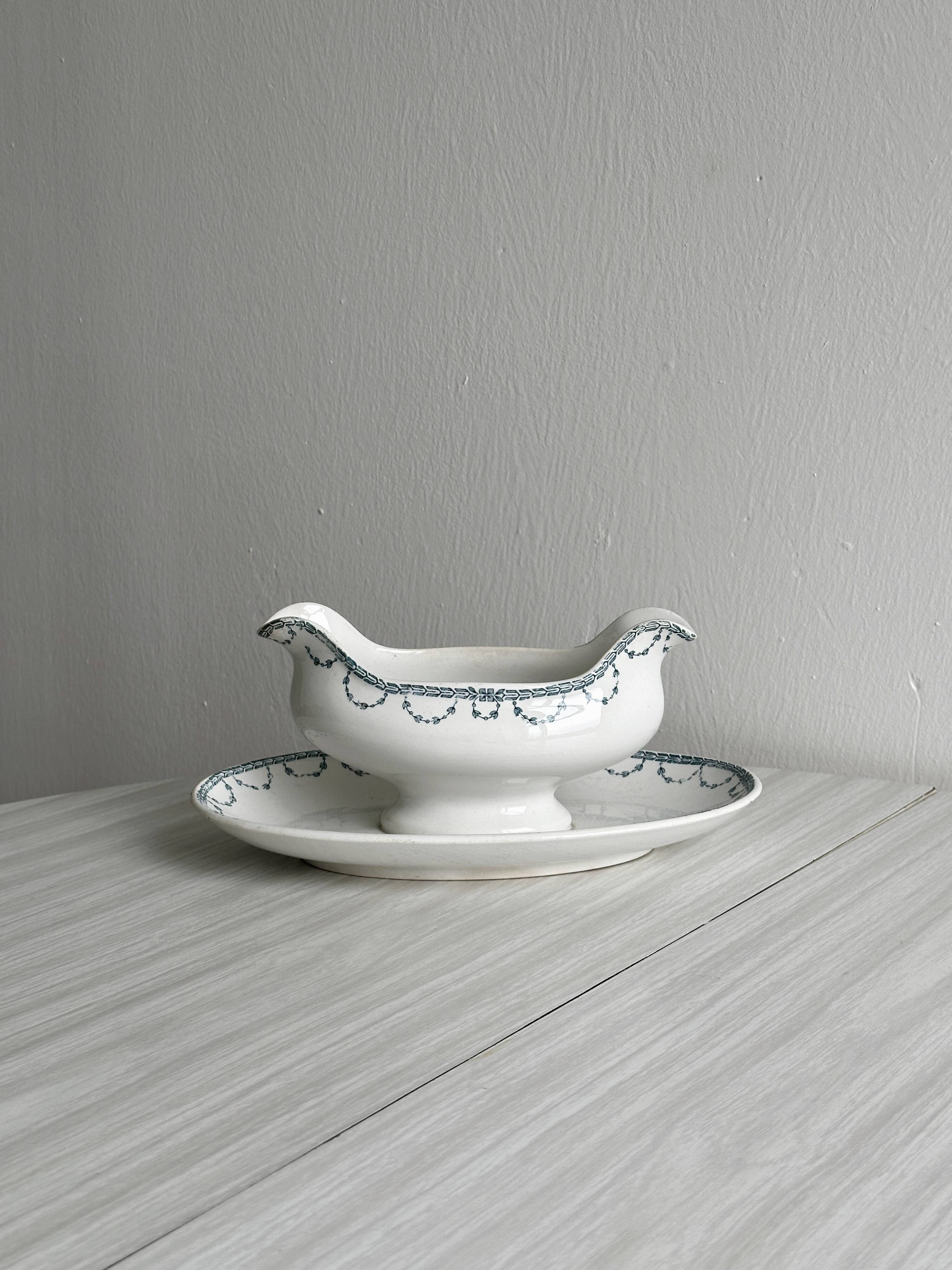 Antique porcelain sauceboat with tray