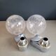 Pair of vintage wall lights in chrome metal with bubbled glass globes.