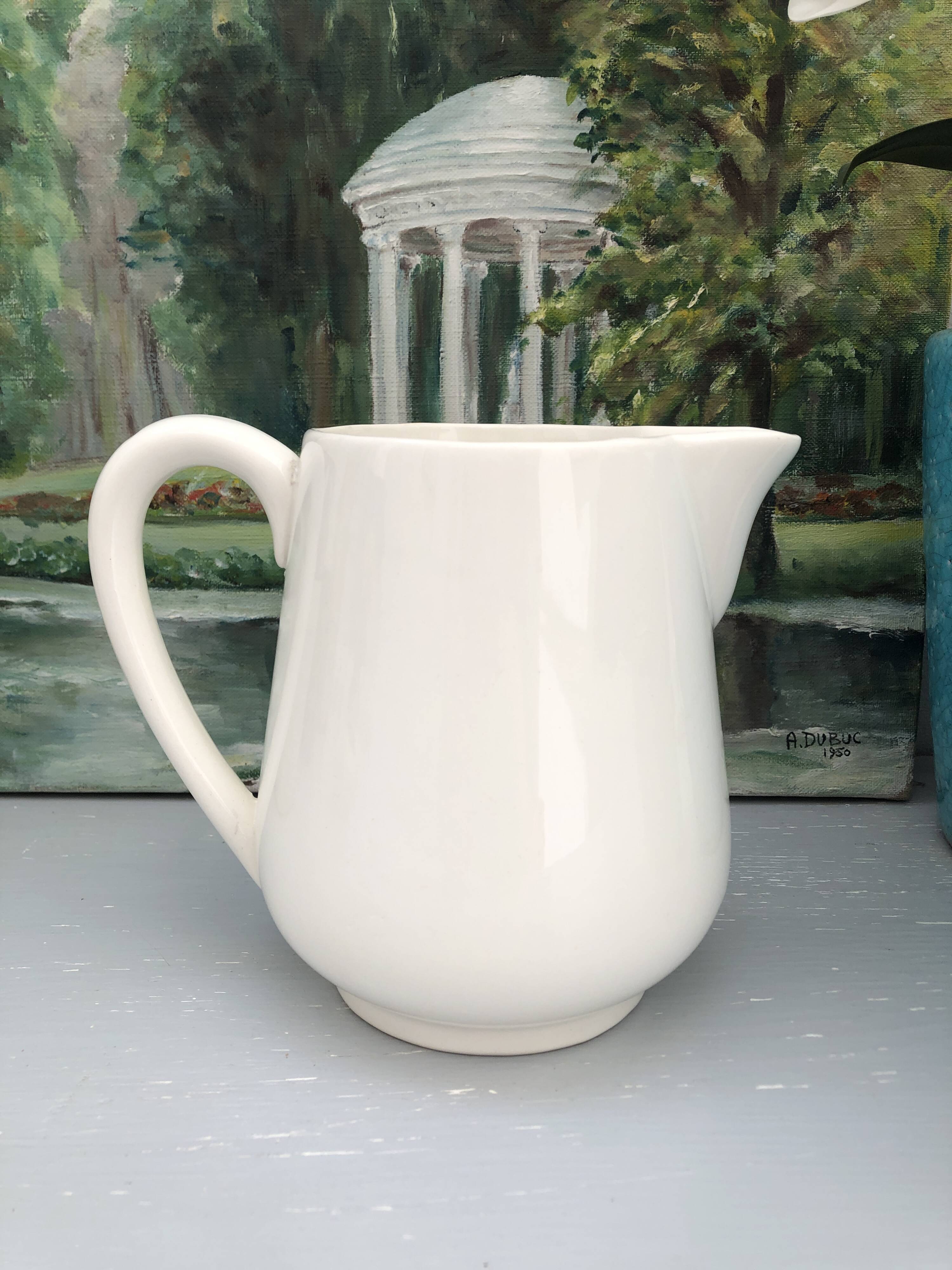 Vintage pitcher in Gien earthenware – daisy floral decoration / orange