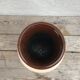 Antique beige ceramic vase with decorative painting