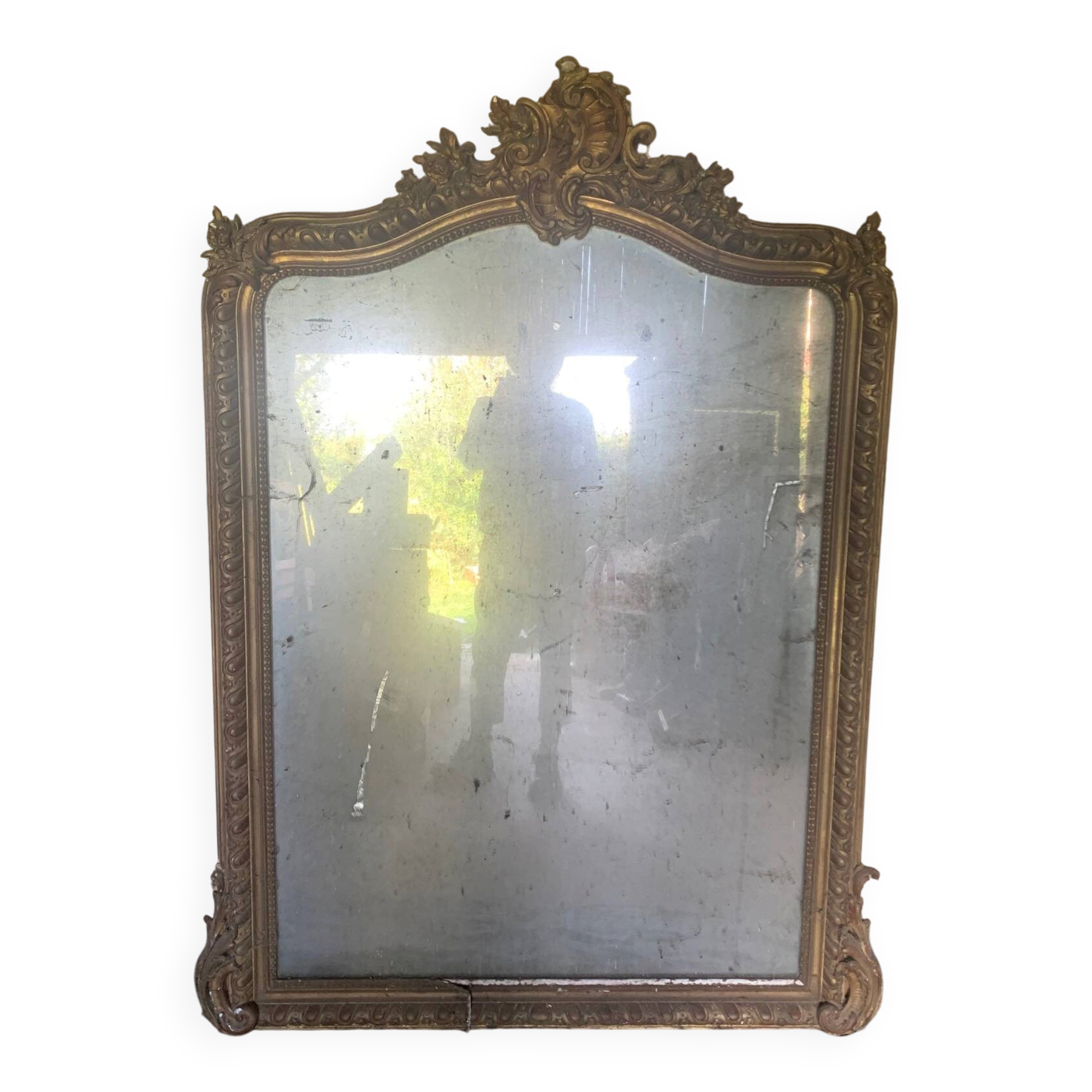 Large antique mirror in wood and gilded stucco.