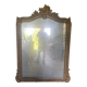 Large antique mirror in wood and gilded stucco.