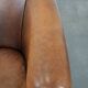 Comfortable club chair made of sheepskin leather