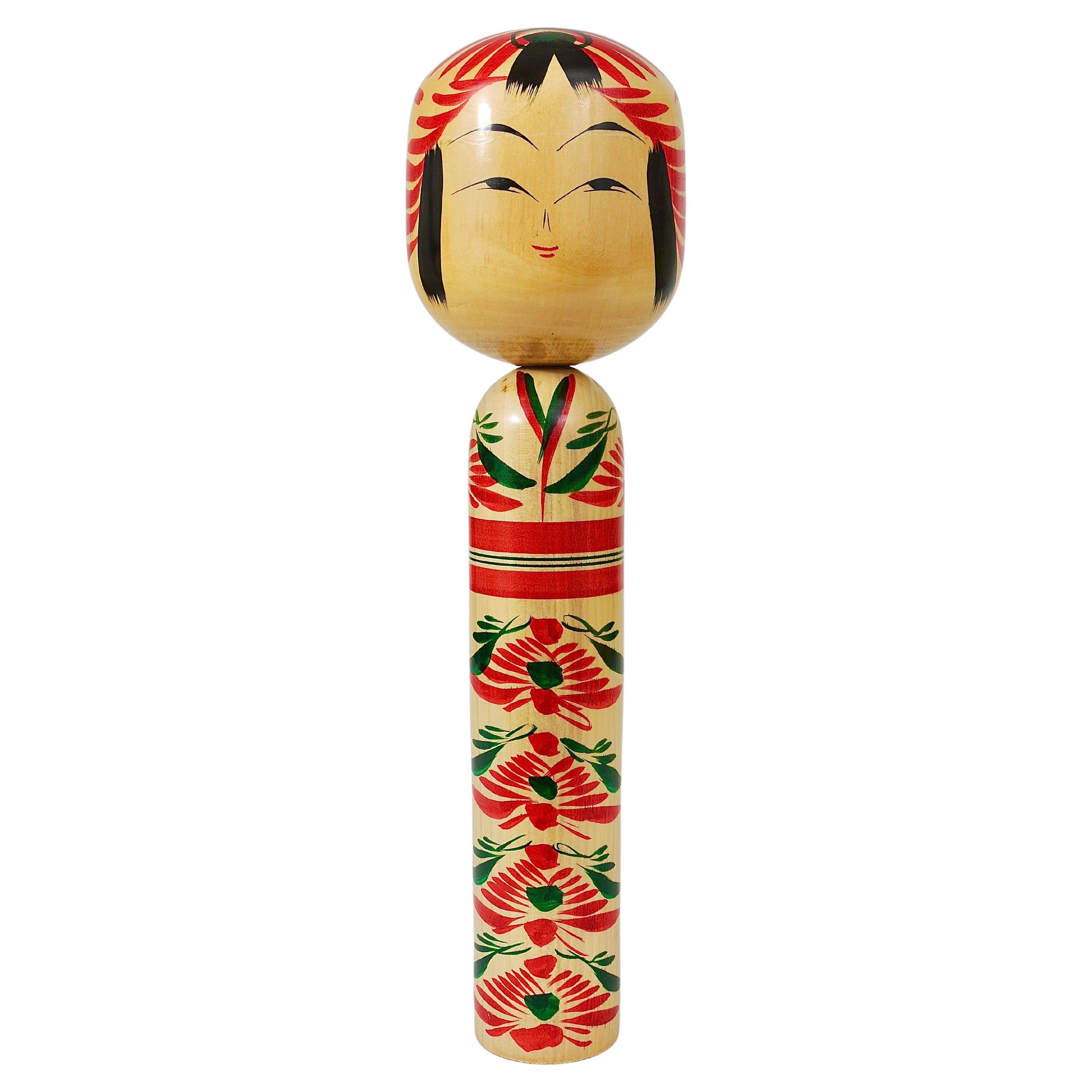 Decorative Kokeshi doll sculpture from northern Japan, hand-painted, signed.