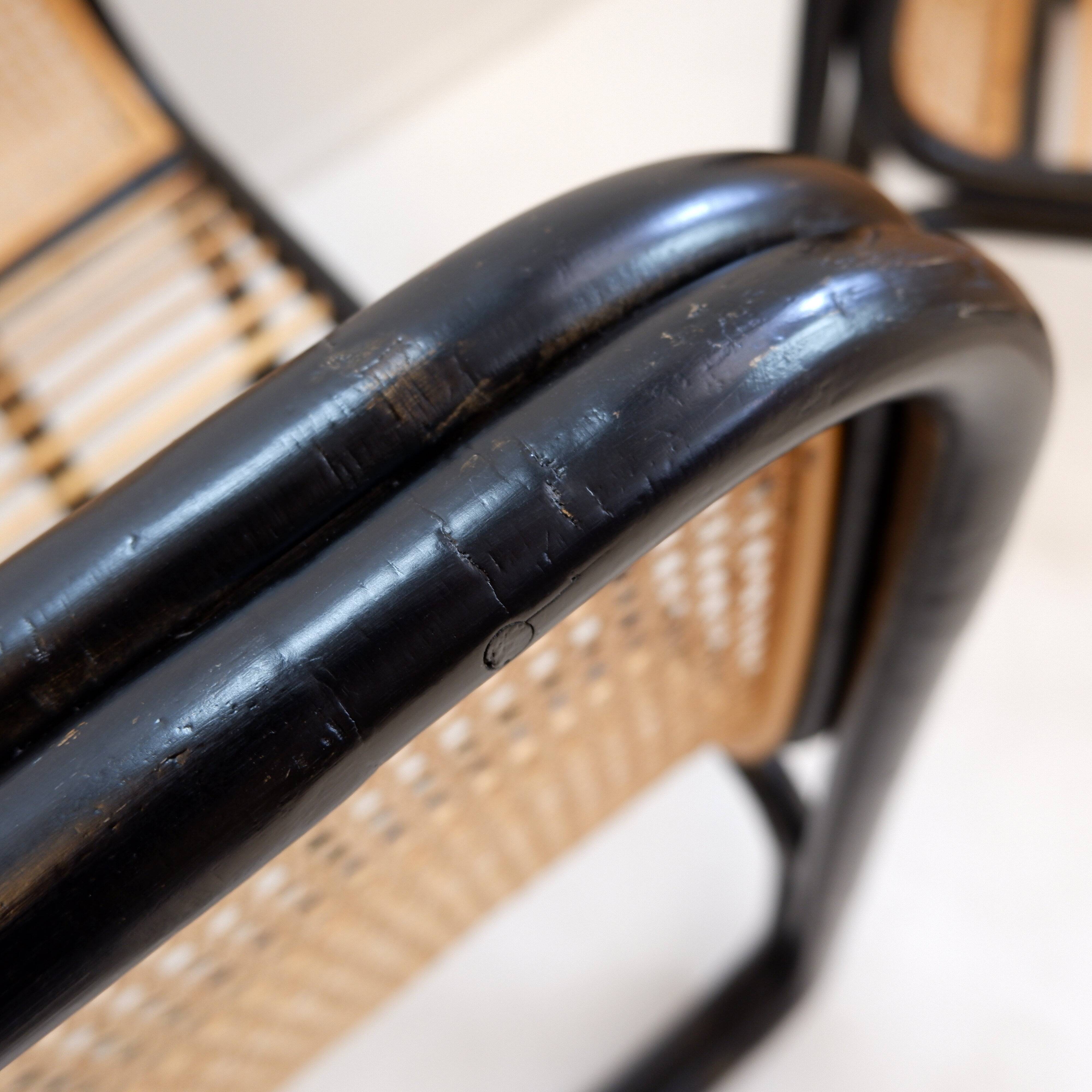 Pair of designer armchairs in curved wood and wicker