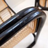 Pair of designer armchairs in curved wood and wicker