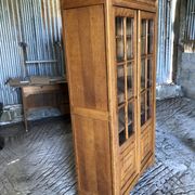 Vintage oak bookcase from the reconstruction period with 2 doors with small panes.