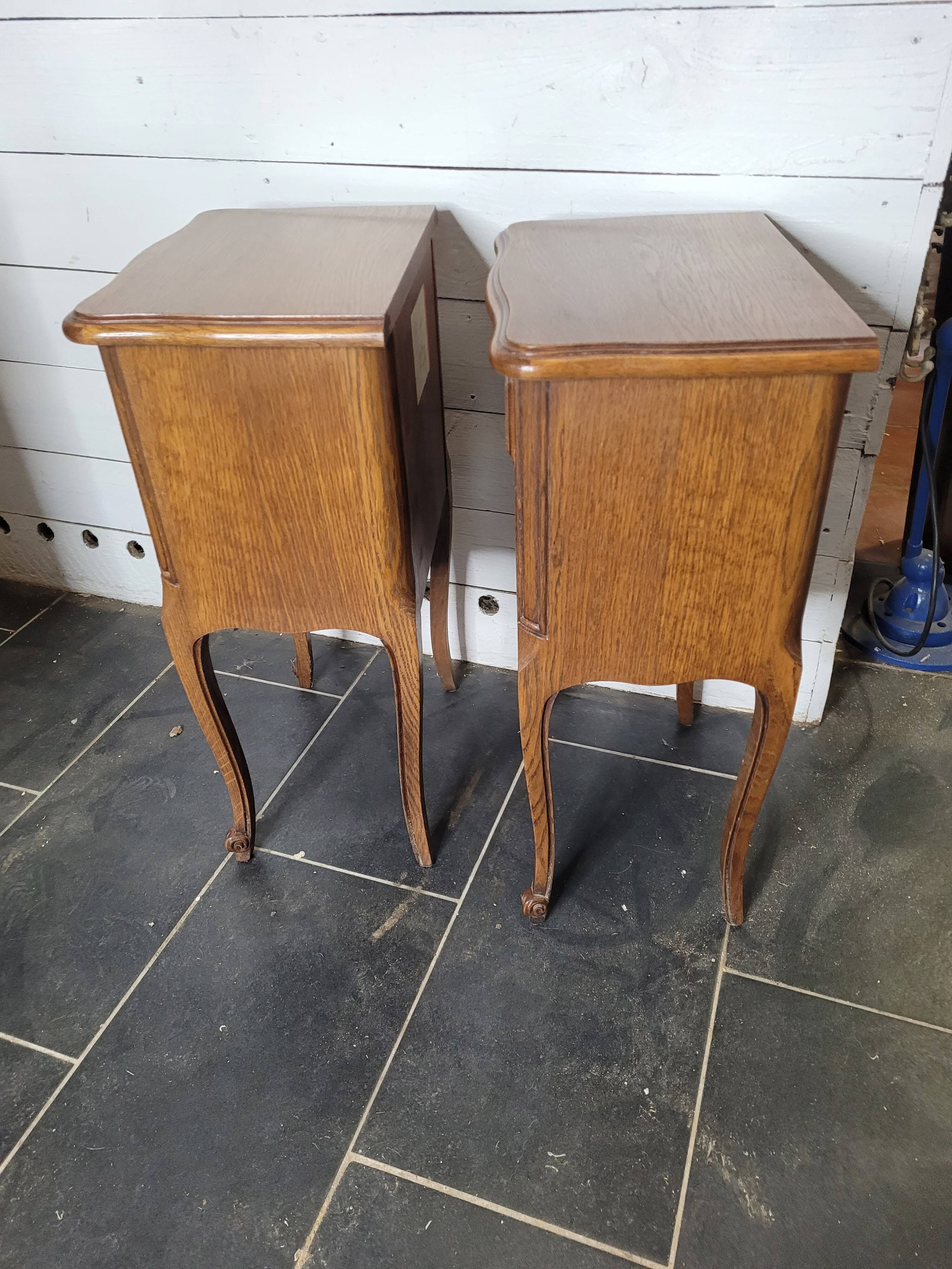 Pair of Louis XV style oak bedside tables