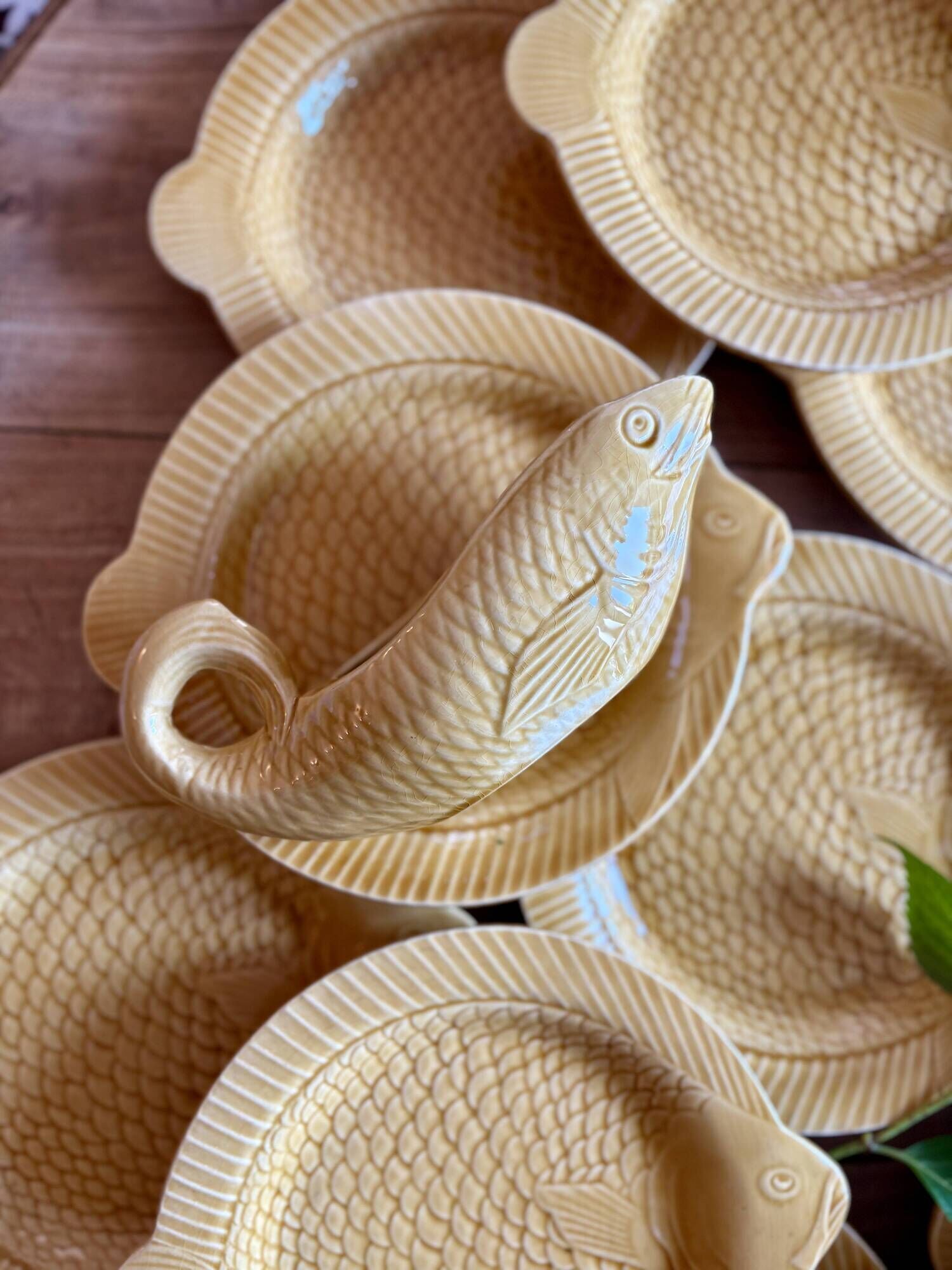 Set of 11 vintage Sarreguemines fish plates and sauceboat