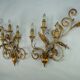 Pair of large floral wall lamps in gilded and lacquered metal. Italy 1960s