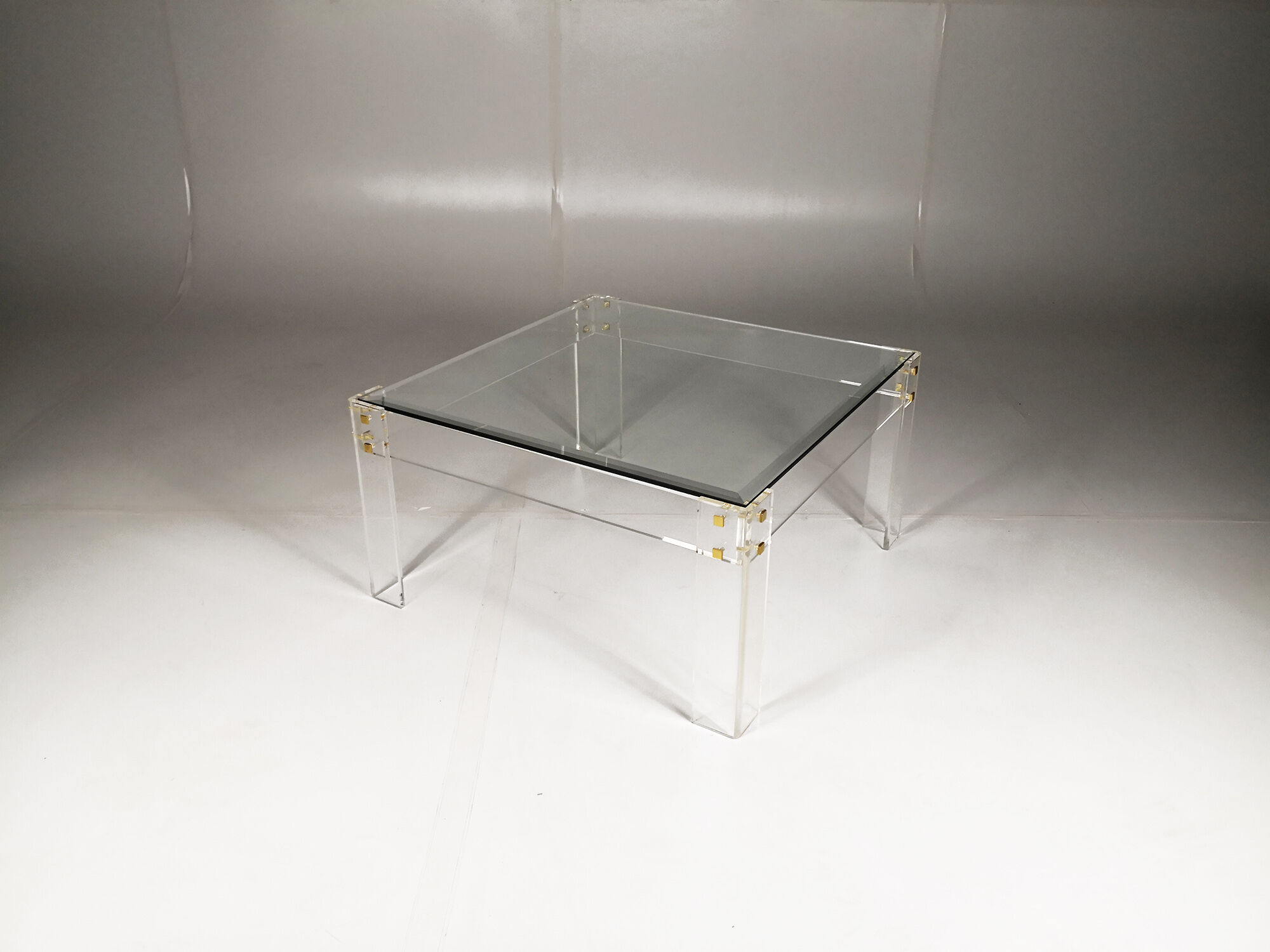 Table low plexiglas and brass, C.1980