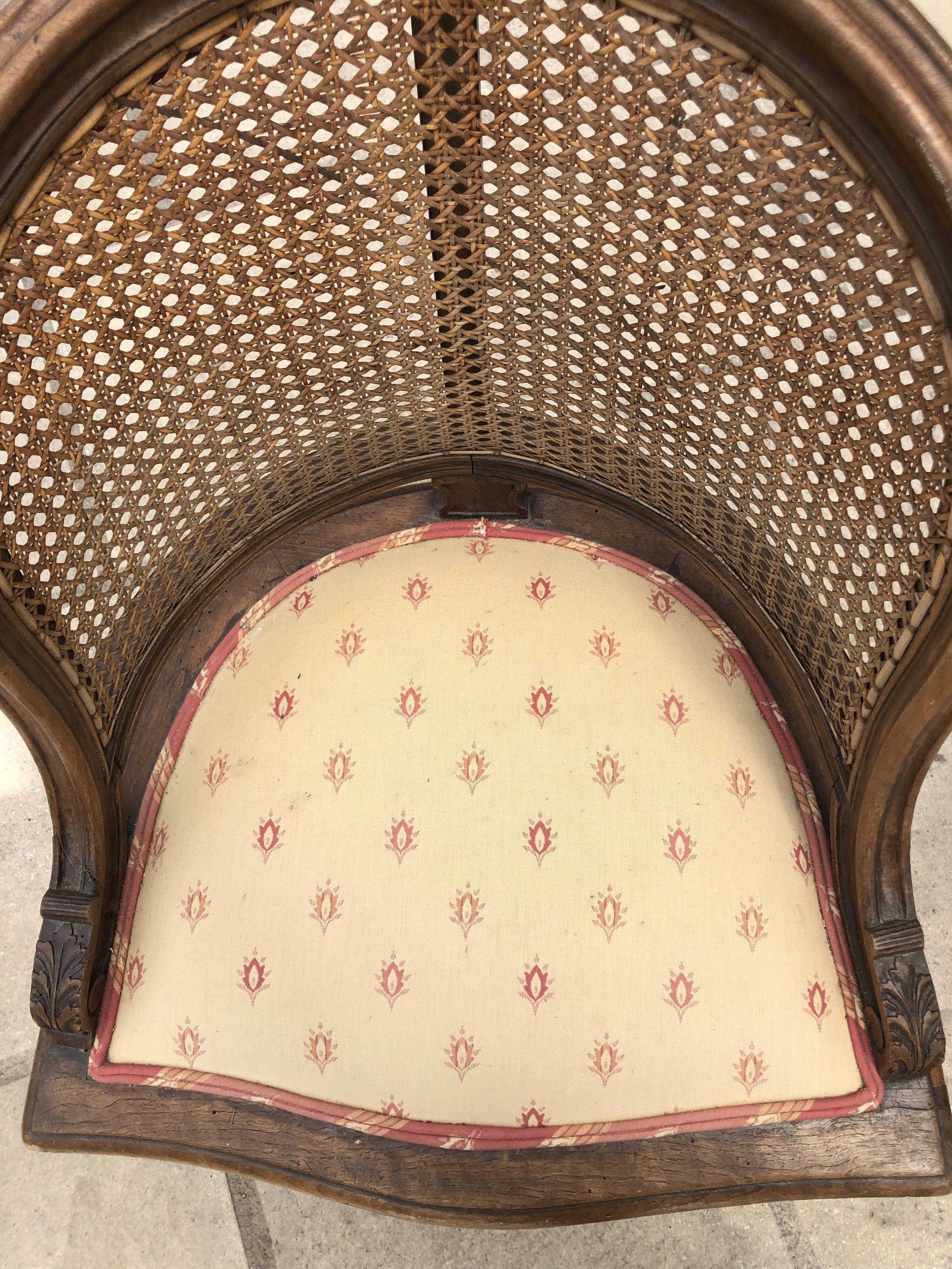 Old wooden armchair and cannage