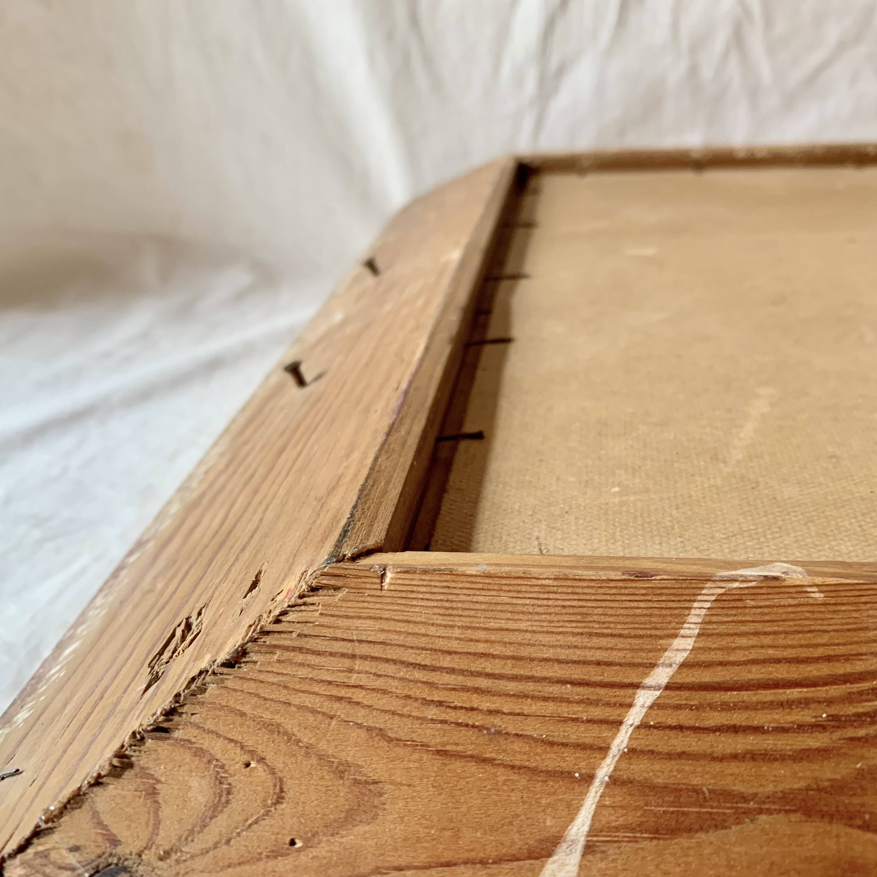 Old wall frame in carved gilded wood