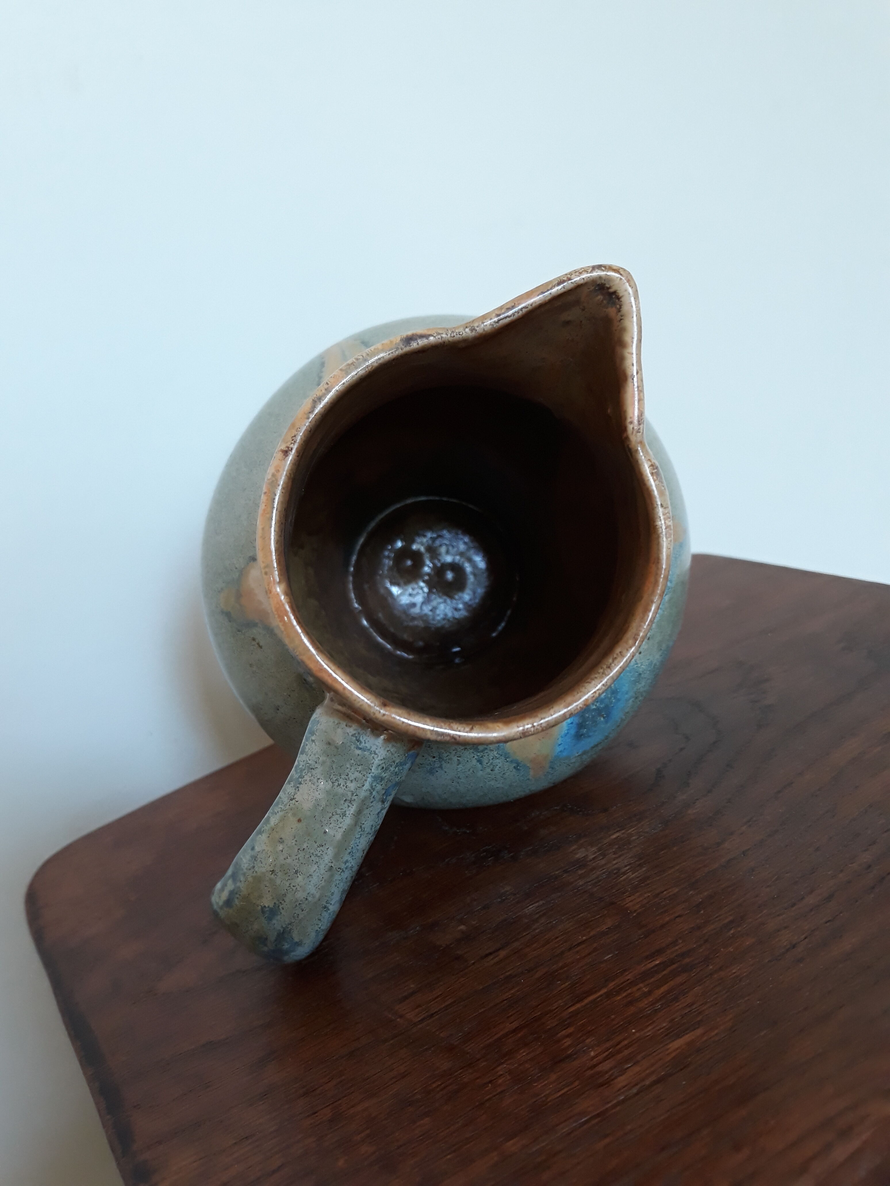 Pitcher ceramic  tones blue, green and caramel